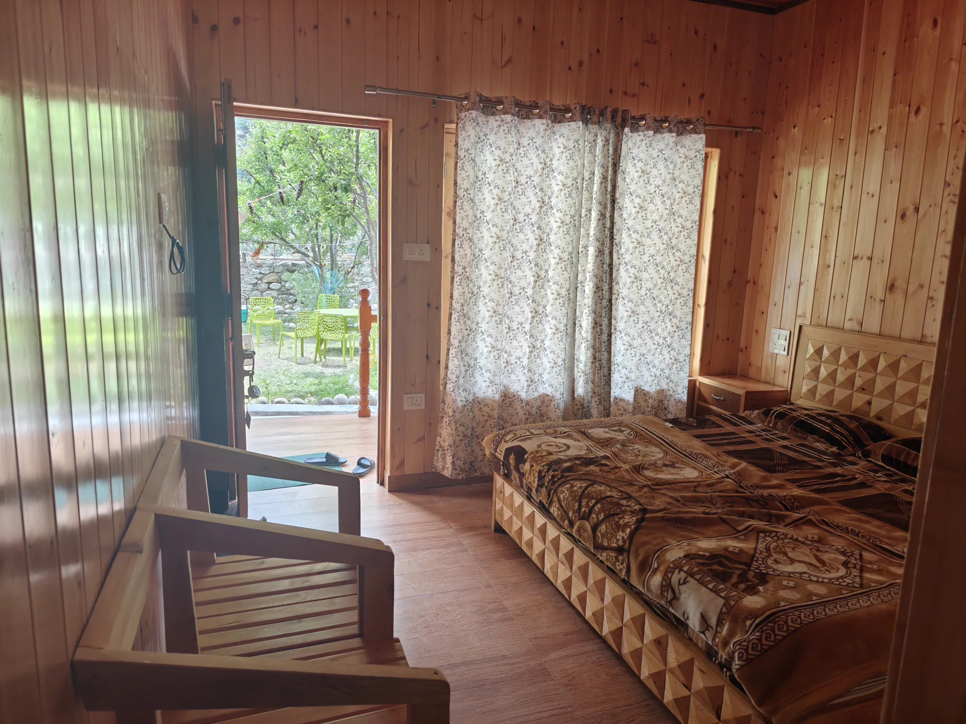 Ground-floor room with a king bed and orchard view